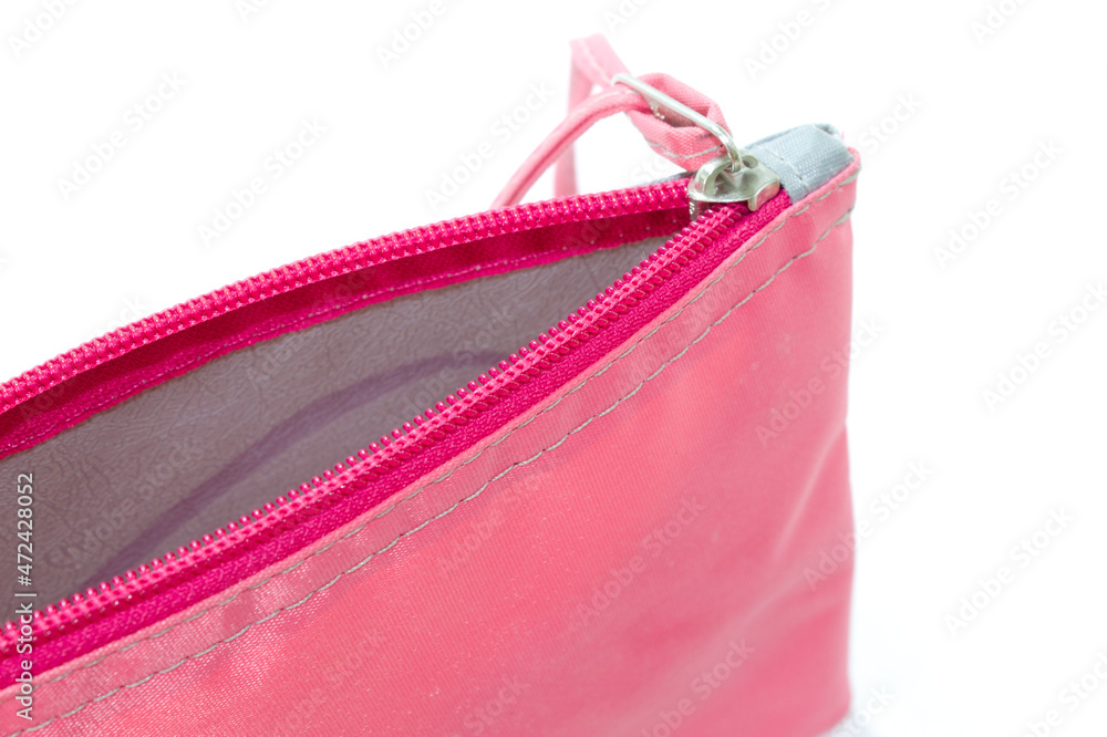 Naklejka premium Pink bag with zipper and white background