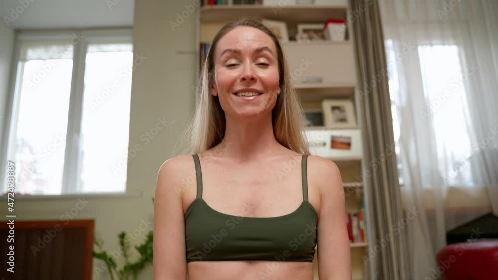 Woman in sportswear speaking on camera Woman in sportswear speaking on camera