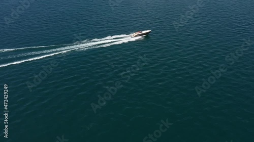 Wallpaper Mural Luxurious big boat fast diagonal movement on blue water, aerial view. Expensive, luxury, high-speed boat moving on the water top view. White boat movement on the water top view. Torontodigital.ca