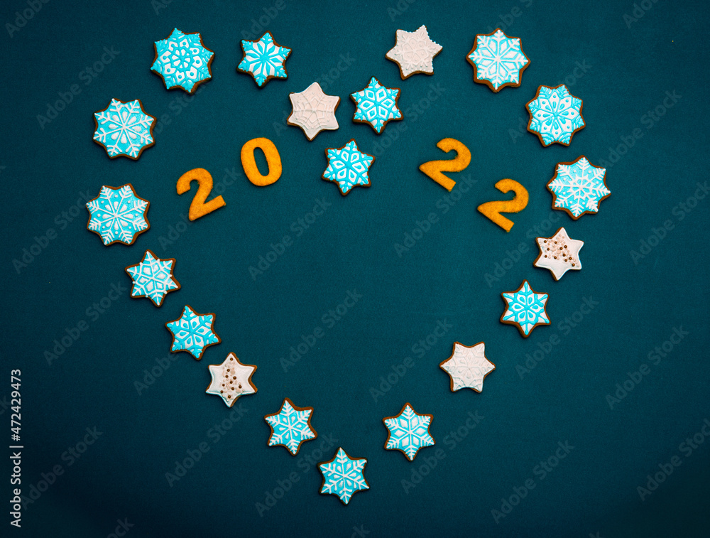 festive Christmas cookies in the heart of stars as a wish of goodness and peace in the new year of 2022 (greeting card, greetings, vintage, love - the concept)