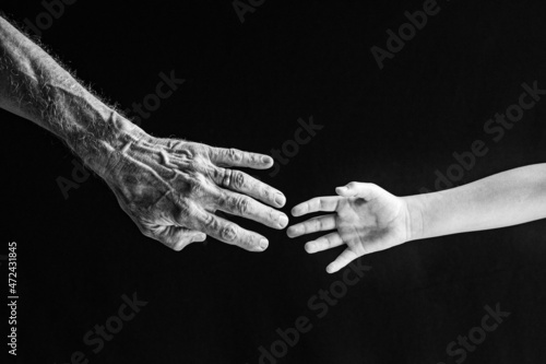 Old and Young Hands Reaching Out for One Another