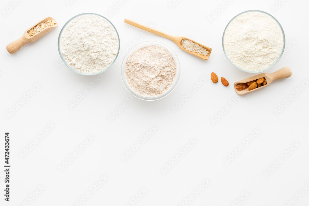 Bowls of various gluten free flour - almond peanut oat and rice buckwheat flour Bowls of various gluten free flour - almond peanut oat and rice buckwheat flour