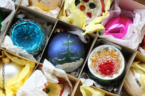 old glass Christmas balls in a box top view. decorations for christmas