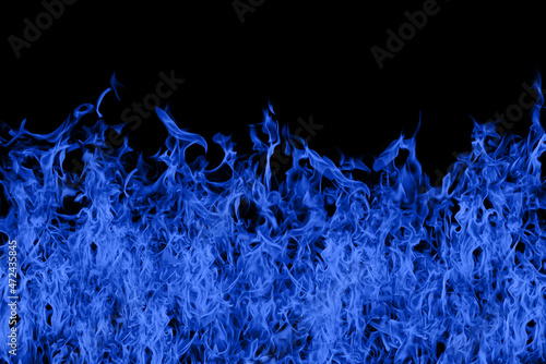Violently burning blue flames on a black background.
