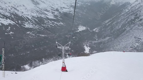 Slow motion. Top view of the ski slope of the mountain resort and the cable car..