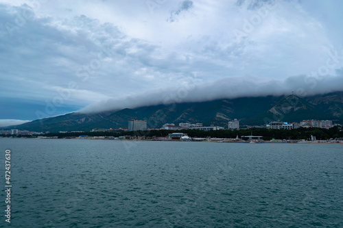 City of Gelendzhik Russia, blue beautiful sky with clouds and mountains in the distance building hotels.