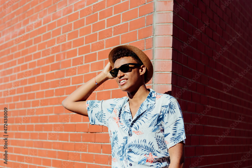 Trendy young black man posing in the street