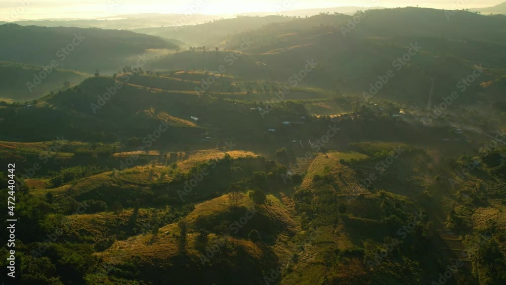 4K Morning mist over a rural village in the high mountains. The sun's rays coming from behind the mountain. bright weather and amazing nature landscape. Loei, thailand
4K Morning mist over a rural village in the high mountains. The sun's rays coming from behind the mountain. bright weather and amazing nature landscape. Loei, thailand
