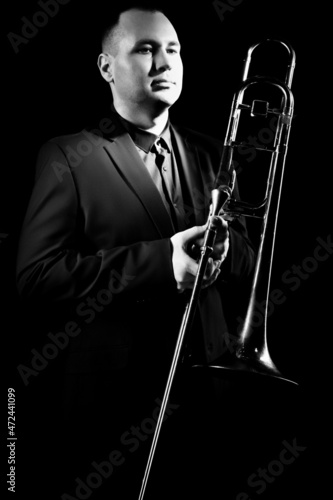 Trombone player. Portrait of jazzman classical musician trombonist photo