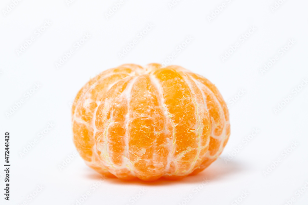 Isolated tangerine on a white background. One peeled mandarin Isolated tangerine on a white background. One peeled mandarin
