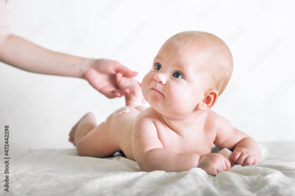 Newborn baby and mother's hands close up and copy space. Child 5 months old massage, colic, teething... Newborn baby and mother's hands close up and copy space. Child 5 months old massage, colic, teething...