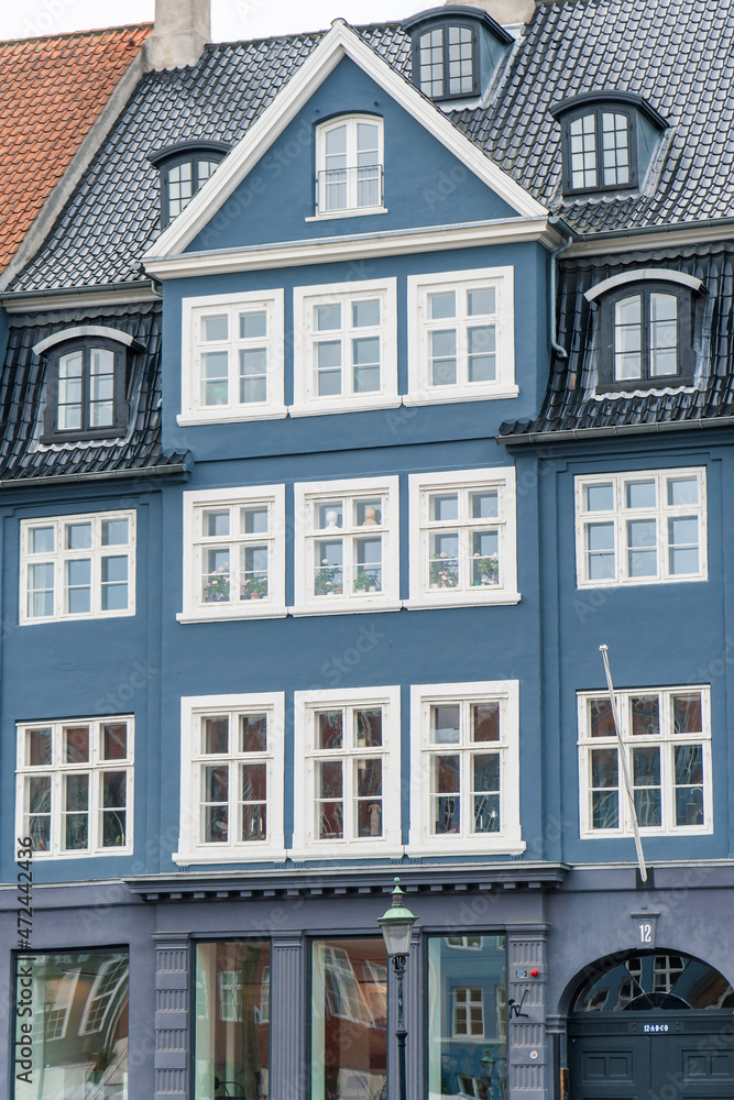 Copenhagen, Denmark - October 1, 2021: Detail of the facade of a house in Nyhavn, in the historical center of Copenhagen