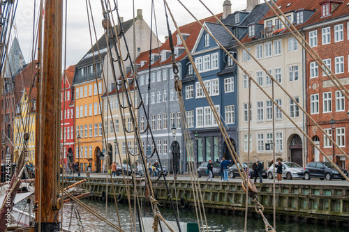 Copenhagen, Denmark - October 1, 2021: view of Nyhavn pier with colorful buildings and boats in Old Town of Copenhagen