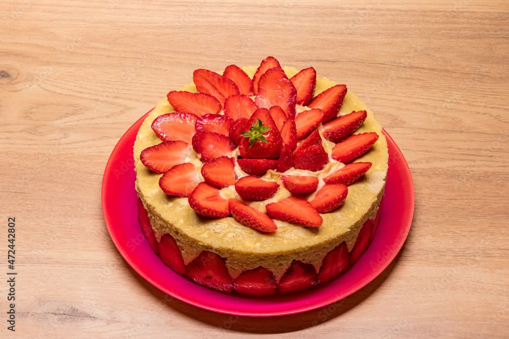 homemade strawberry cake in a red dish