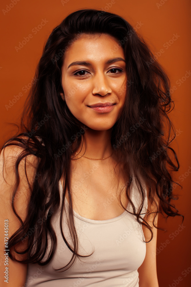 cute happy young indian woman posing cheerful on brown background in studio close up smiling, fashion beauty cute happy young indian woman posing cheerful on brown background in studio close up smiling, fashion beauty