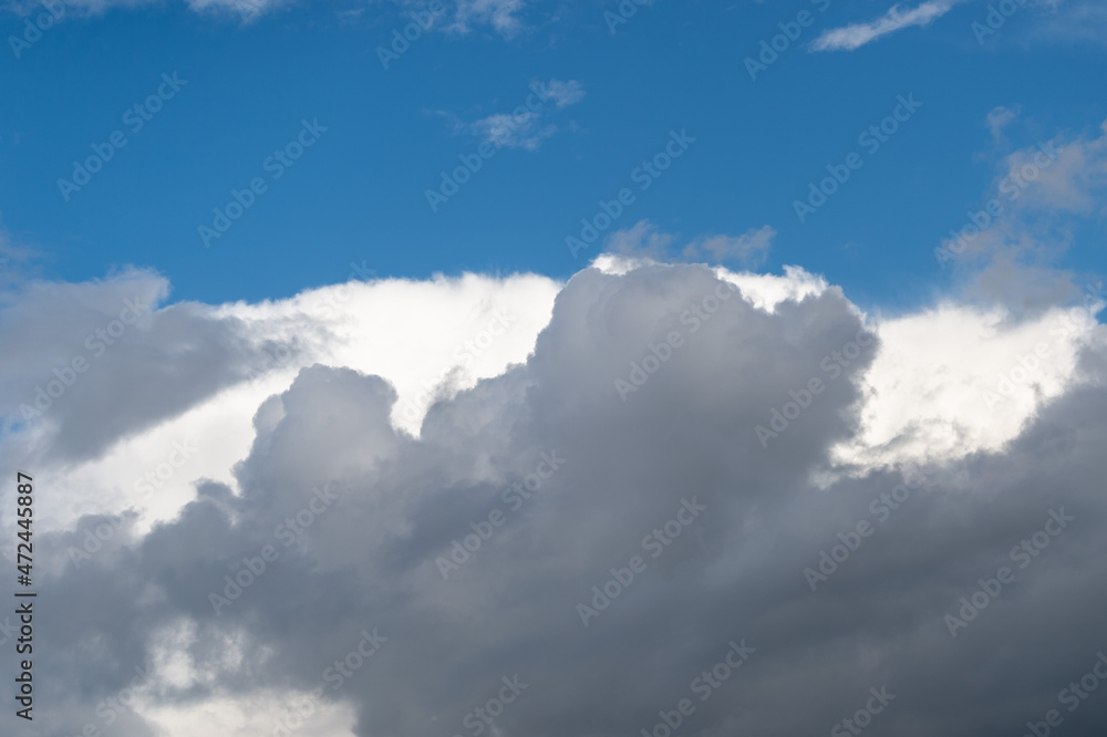 White and gray cumulus clouds with rain. Background with white clouds, climate change. Picture for weather forecast. White and gray cumulus clouds with rain. Background with white clouds, climate change. Picture for weather forecast.