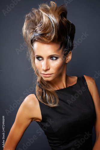 young elegant woman with creative hair style zebra print close up pretty like punk studio halloween look fashion