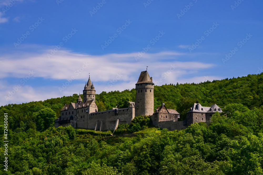 Altena Castle panorama in Sauerland Germany. Popular landmark, sight attraction in Lenne Valley and a mediaval monument with First Youth Hostel of the world situated on green hill above the city, 2014