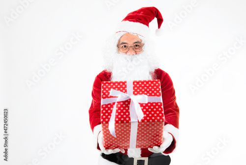 Christmas gift and happy New Year- Santa claus giving gift box. Santa claus with giftbox of presents on white background.