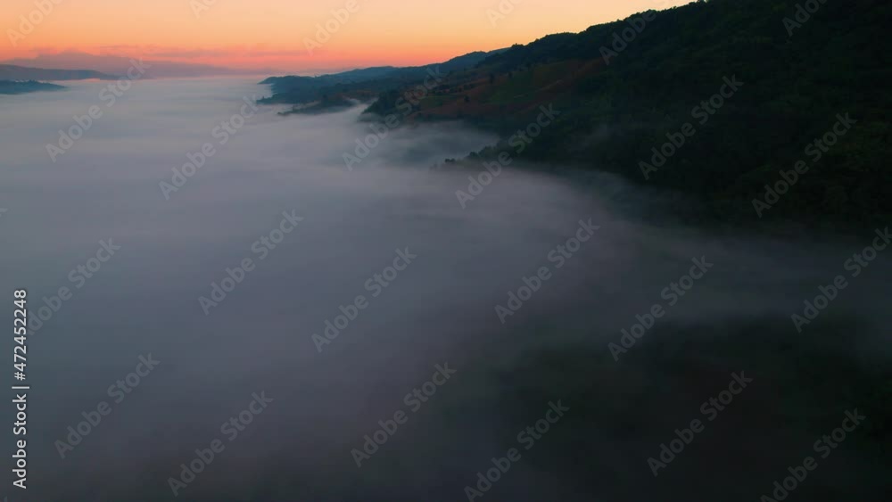 4K Scenic flight over beautiful mountain scape with bright sky and fog clouds on summer sunrise. Flight above clouds
4K Scenic flight over beautiful mountain scape with bright sky and fog clouds on summer sunrise. Flight above clouds