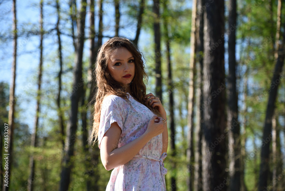 Pretty, young woman posing in the forest. Green surroundings during spring in Poland. Pretty, young woman posing in the forest. Green surroundings during spring in Poland.