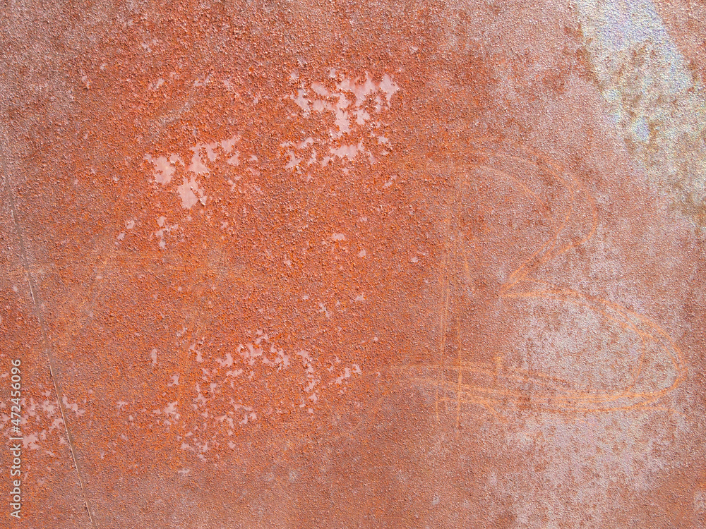 A red and brown piece of rusty metal with stains of paint. Abstract industrial background. A red and brown piece of rusty metal with stains of paint. Abstract industrial background.