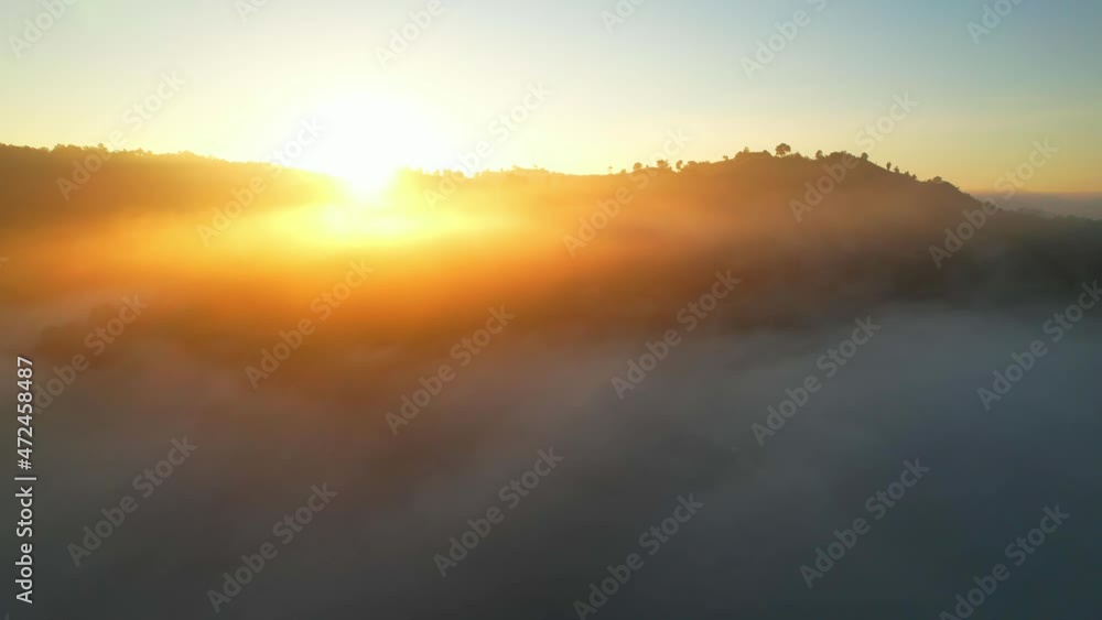 4K Aerial view flying in fog. the sun is hidden behind the clouds at sunset fog.
4K Aerial view flying in fog. the sun is hidden behind the clouds at sunset fog.