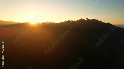 Wallpaper Mural 4K Aerial view of the misty sunrise in the forest. sun beam coming from behind the mountain, Tropical Rainforest in Thailand
 Torontodigital.ca