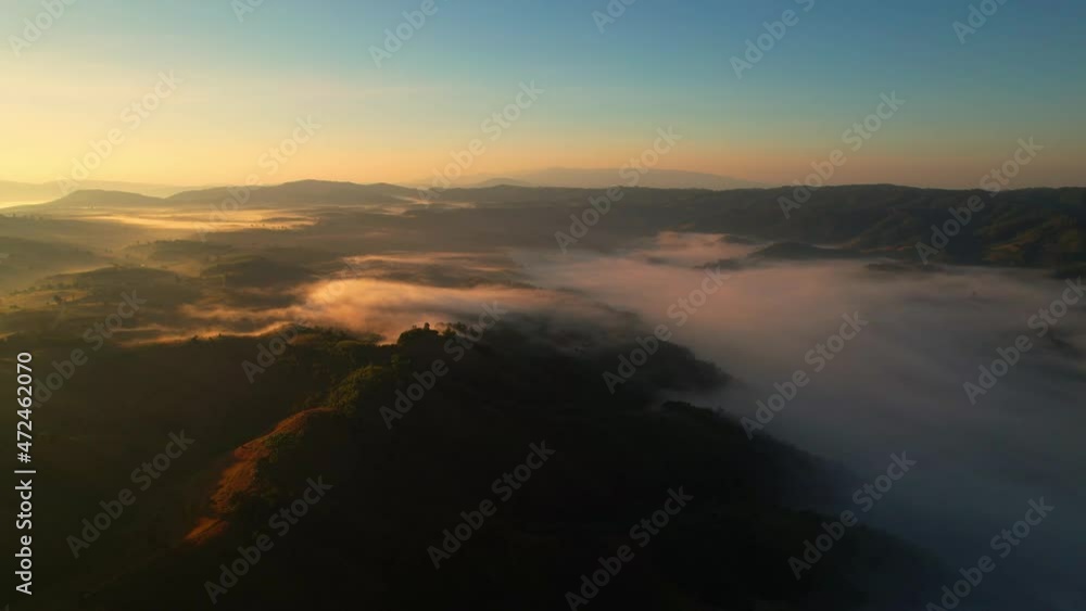 4K Drone Flying through the clouds at dusk or dawn. Aerial top cloudscape view from drone. Tropical forest with smoke and fog.
4K Drone Flying through the clouds at dusk or dawn. Aerial top cloudscape view from drone. Tropical forest with smoke and fog.
