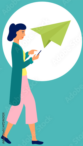 Young happy woman walking with mobile phone using smartphone to share posts and news in social networks, chatting with friends, sending message. Girl holds smart phone to make repost of video and news