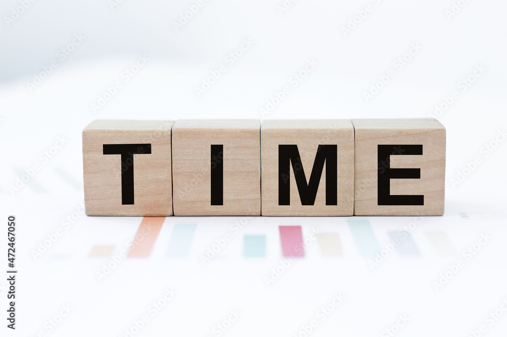 Text TIME on wood cube blocks, stock investment concept. Text TIME on wood cube blocks, stock investment concept.