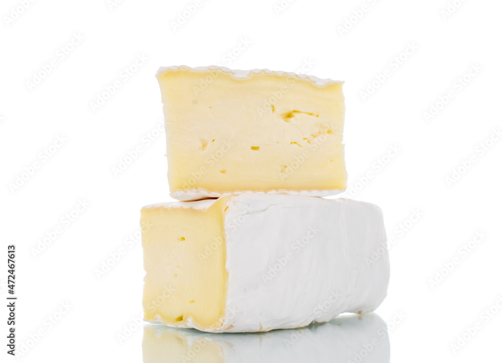 Two fragrant pieces of brie cheese, close-up, isolated on white.
