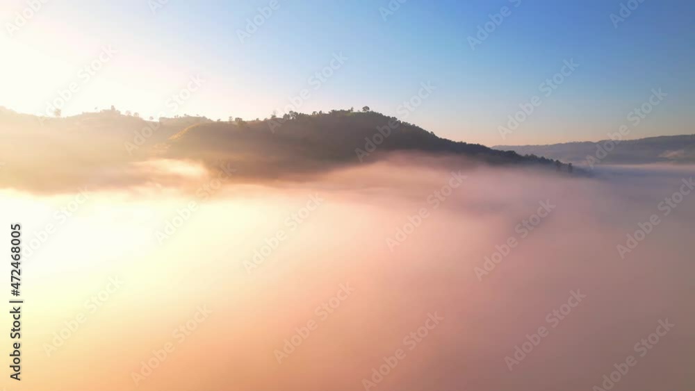 4K Scenic flight over beautiful mountain scape with bright sky and fog clouds on summer sunrise. Flight above clouds
4K Scenic flight over beautiful mountain scape with bright sky and fog clouds on summer sunrise. Flight above clouds