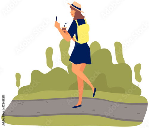 Young happy woman walking in park with mobile phone and coffee using smartphone to share posts and news in social networks, chatting with friends. Girl holds smart phone to make repost of video