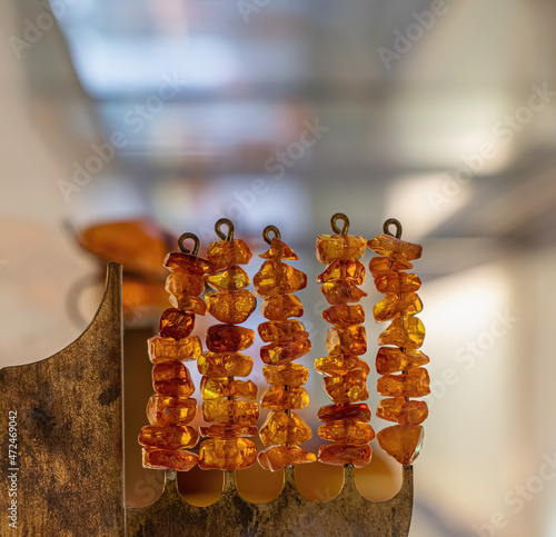 Small amber pieces on wire  rods photo