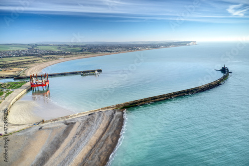 Aerial view along the entrance to Newhaven port and the beach which leads to Seaford.. photo