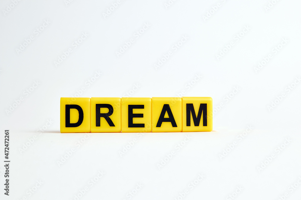 The word dream consists of individual cubes with letters. The word dream consists of individual cubes with letters.