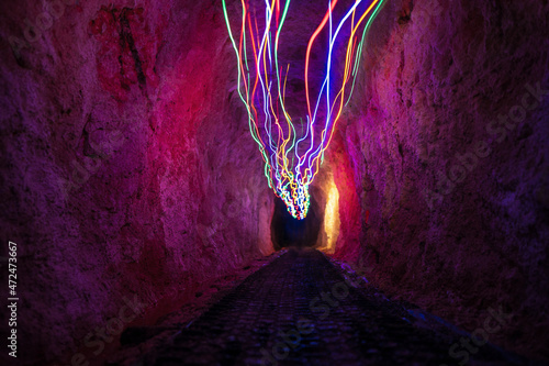 Light painting in the Historic rail tunnel, a part of an old gold mine transportation system located in Collins Drive Circuit, New Zealand photo