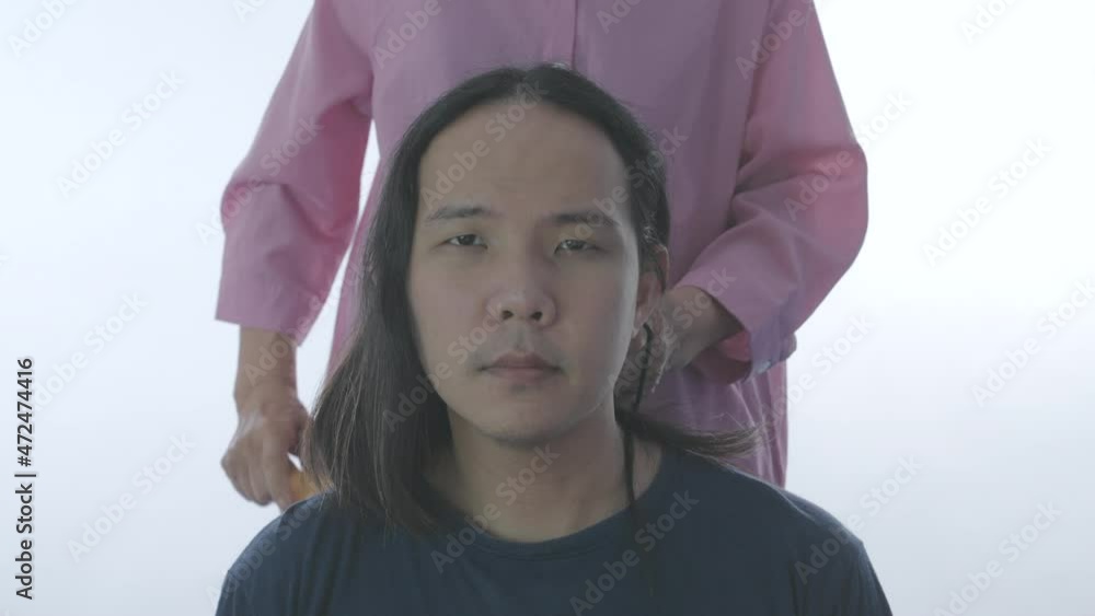 Hair care concept of 4k Resolution. Hairdresser is tying hair for customers. Hair care concept of 4k Resolution. Hairdresser is tying hair for customers.