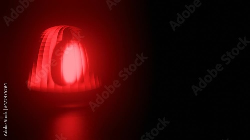 Red and blue flashing warning light on black background. Ambulance, Fire or Police Emergency rotating beacon. Seamless Looped video. photo