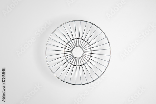 Modern style fruit basket made of steel wire isolated on white background.High resolution photo.Top view. Mock-up.