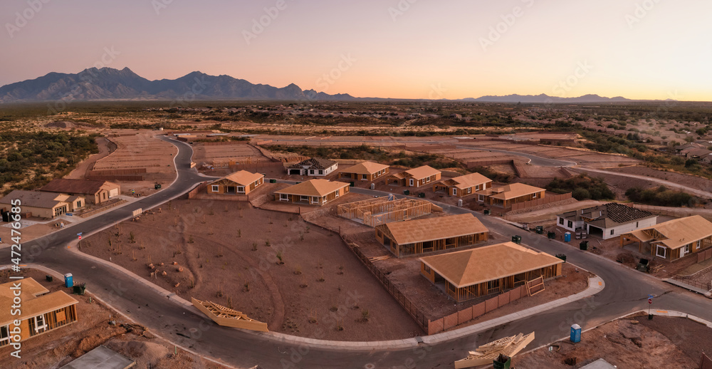 Obraz premium New home construction in Sahuarita Arizona, aerial at sunset, very large panorama.