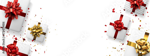 White gift boxes with red and golden bows.