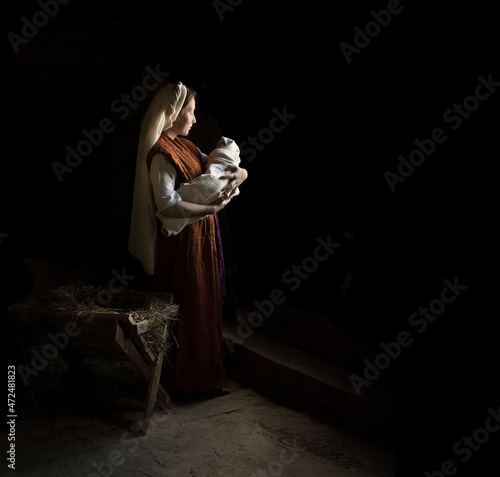 Mary in the stable near the manger with the baby