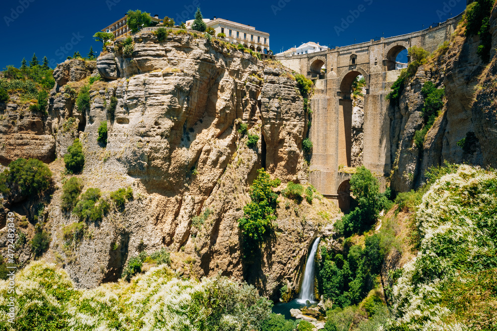The New Bridge - Puente Nuevo and waterfall in Ronda, Province Of Malaga, Spain.