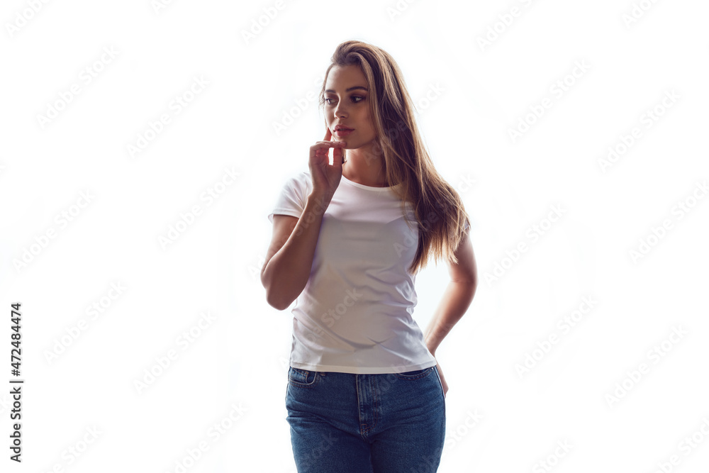 Beautiful young woman in white blank t-shirt isolated on white background. Beautiful young woman in white blank t-shirt isolated on white background.