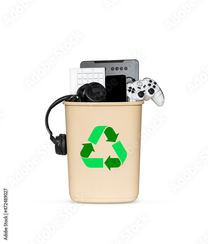 many tech gadgets in the trash bin for disposal and reuse. ecology concept