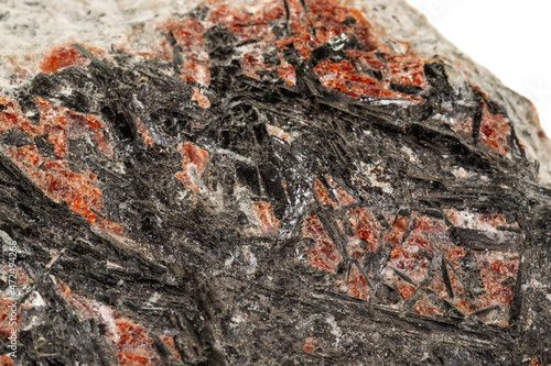 Macro of a stone Stibnite mineral on a white background