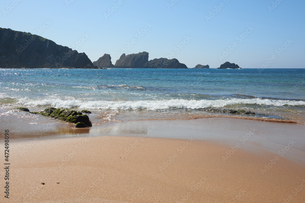 A quiet beach with a turquoise blue sea