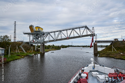 Russia. White Sea-Baltic Canal. The ship approaches the raised Railway Bridge over the Shizhnya River photo